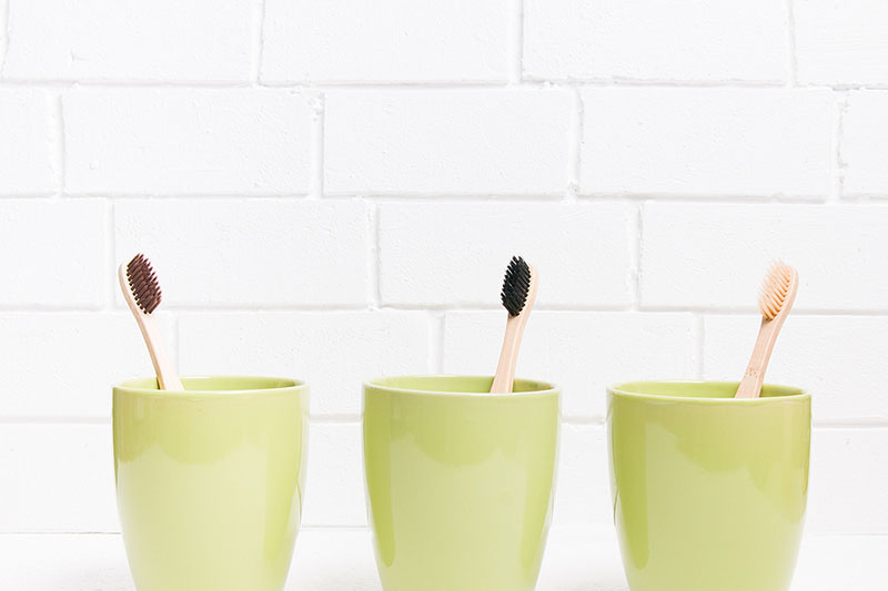 Safely store toothbrushes in separate cups